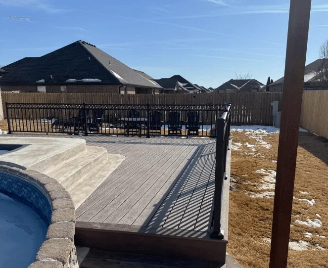Armadillo composite deck with black aluminum railing — JHG Contracting LLC serving Lowell, AR