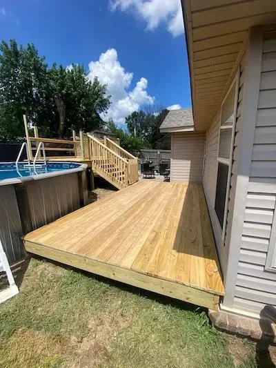 8x24 custom deck alongside pool NWA Region — JHG Contracting LLC