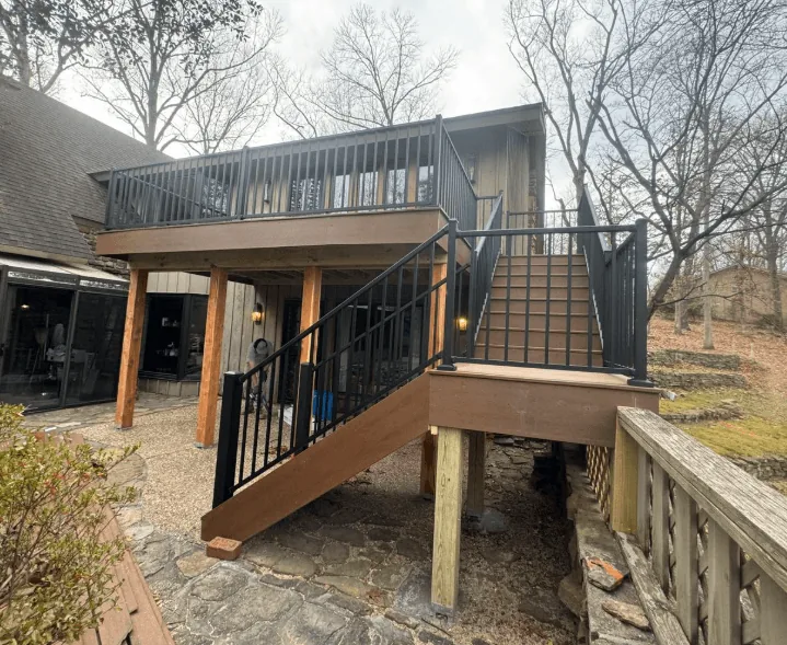 Elevated composite deck with black metal railings and stairs — JHG Contracting LLC serving Summers, AR