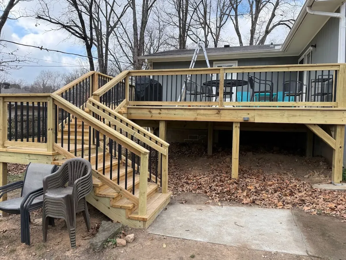 Wood deck with black balusters Fayetteville AR — JHG Contracting LLC